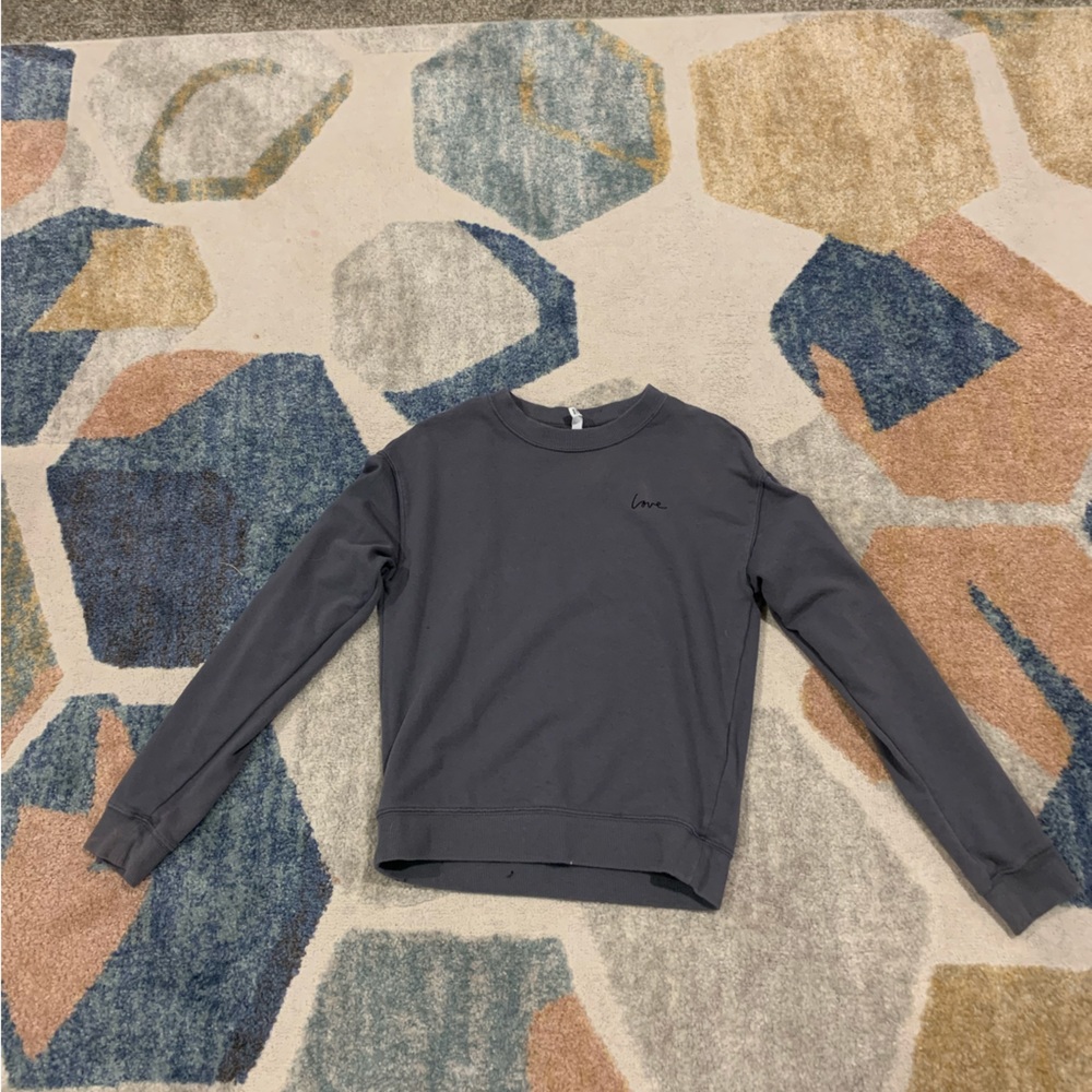 Dark grey crew neck with stitched on love in the corner, No rips no cuts on it